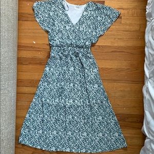 BRAND NEW floral maxi dress with flutter sleeves.